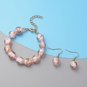 NWOT Pink Colored Glass Adjustable Bracelet and Earrings in Goldtone